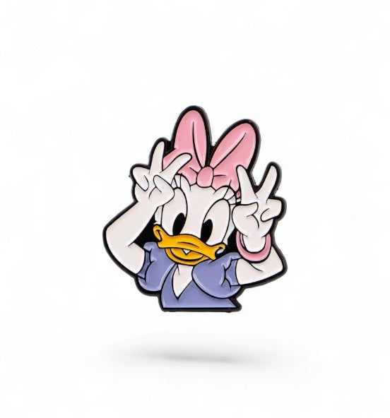 Pins & Co. Daisy Duck enamel lapel pin featuring her in a purple outfit and pink bow making a peace sign gesture.