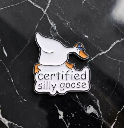 Pins & Co. Certified Silly Goose enamel lapel pin featuring a white goose in a blue baseball cap.
